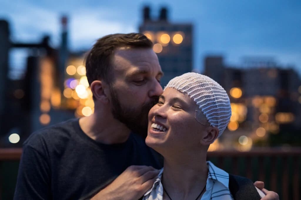 Portrait of confident businessman with arms crossed standing outdoors in urban environment